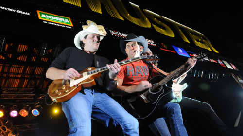 Lee Kernaghan and his band rock the Muster Main Stage on Sunday night. Lee Kernaghan and his band rock the Muster Main Stage on Sunday night.